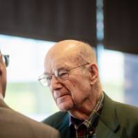 Bob Thompson speaking with gentleman at dedication event